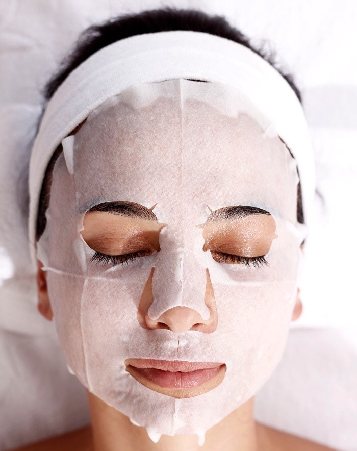Woman wearing Simple Glow active-rich sheet mask